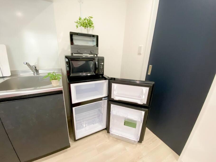 Residential Hotel Glitter Usjまで1駅5分 大阪 客房 照片